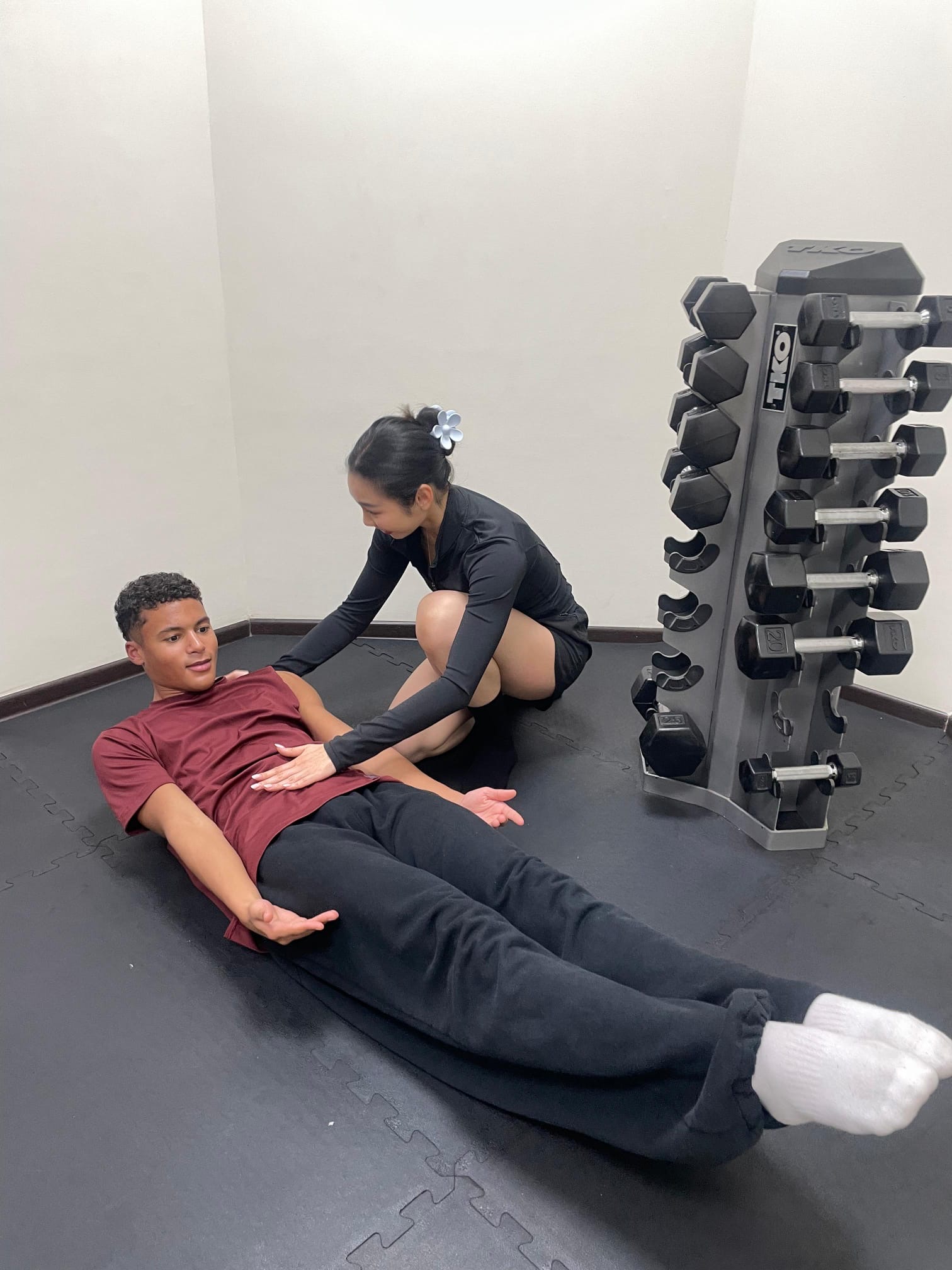 PTatHome personal trainer conducting a corrective exercise assessment